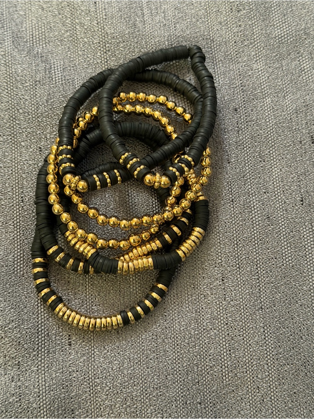 Black and Gold Stacked Beaded Stretch Bracelet Set. Silicones and plastic